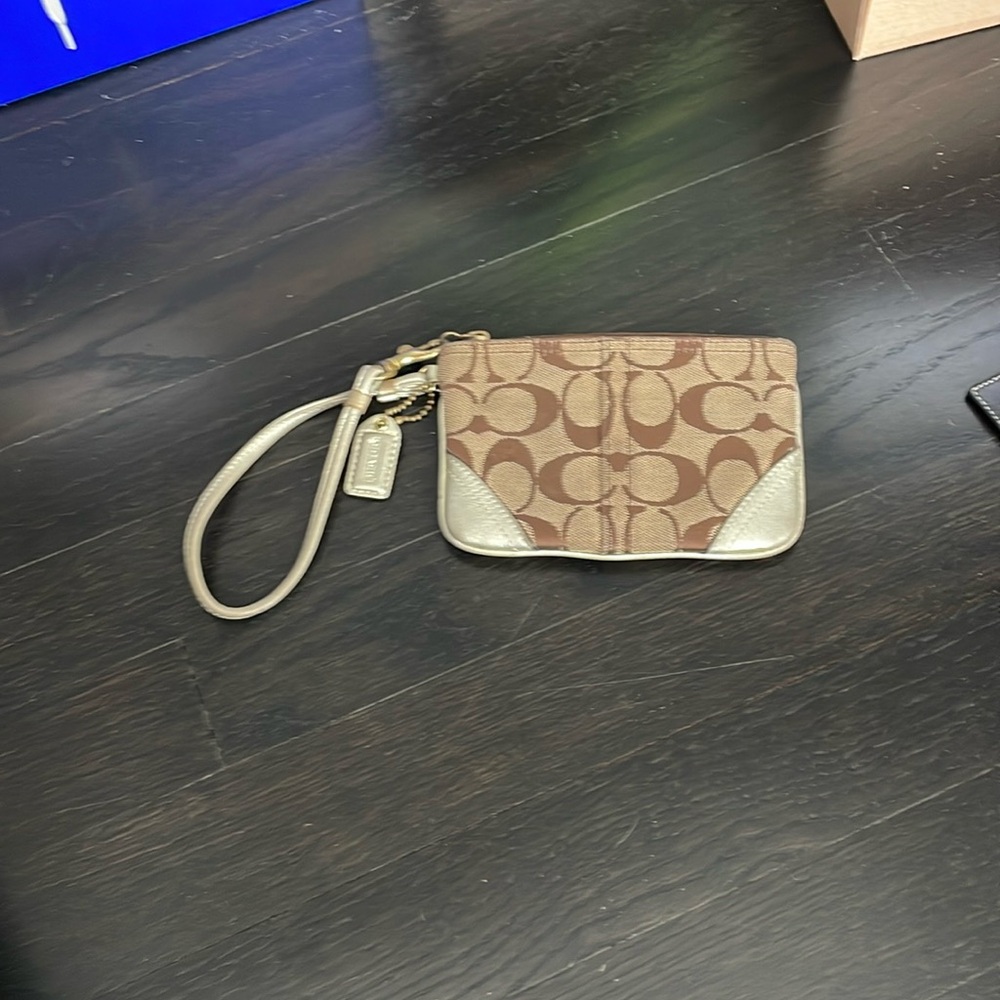 Gold and brown coach wristlet